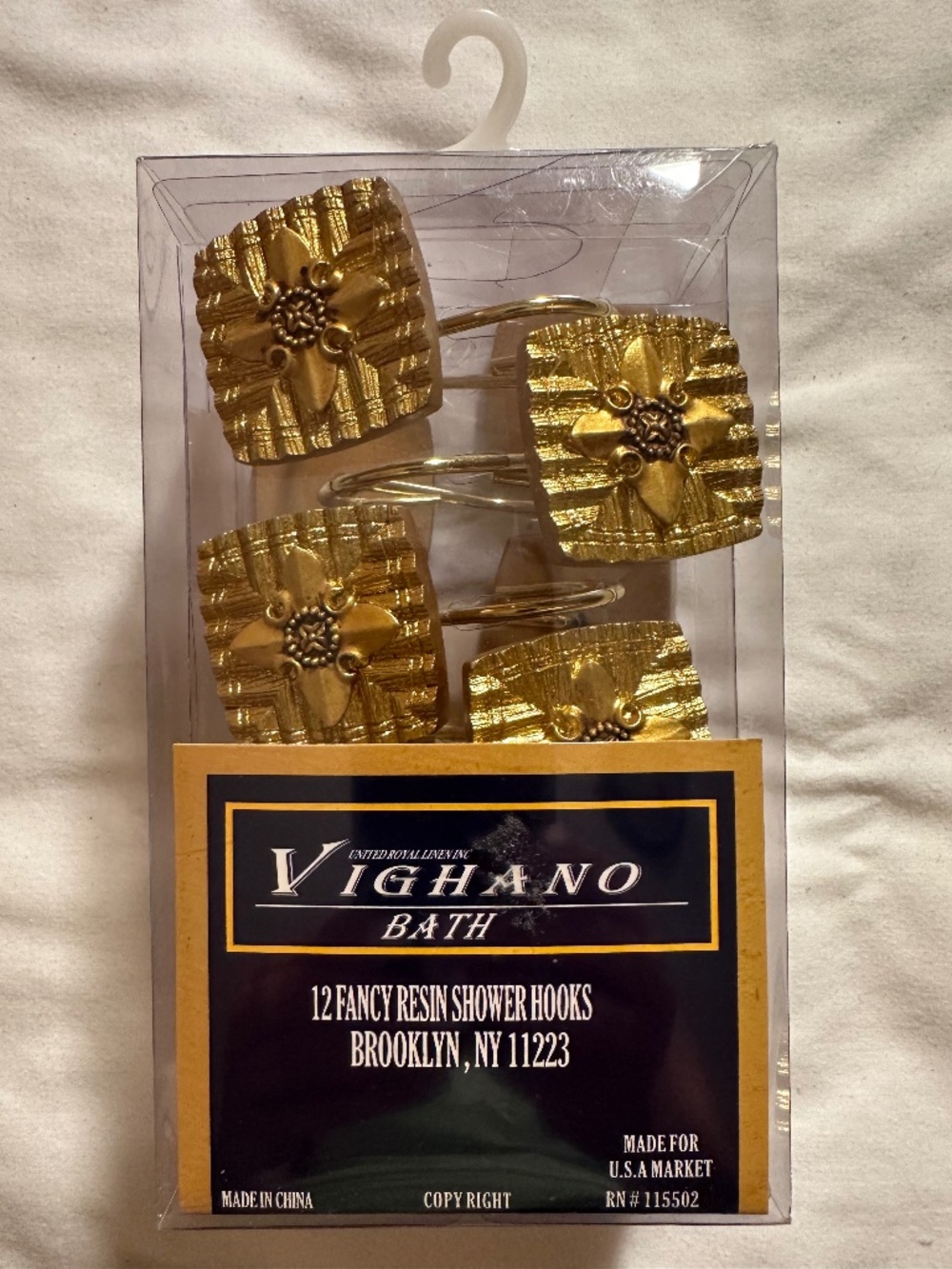 Vighano Bath, gold shower curtain hangers